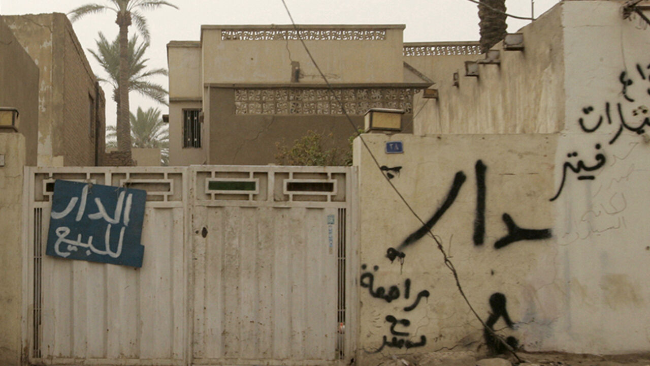 IRAQ/REALESTATE A "For Sale" sign hangs outside the gate of a house in Baghdad September 10, 2008. A dramatic fall in violence has breathed life into Baghdad's once moribund property market, but the hunt for homes in Sunni and Shi'ite enclaves bodes ill for sectarian reconciliation in the Iraqi capital. To match feature IRAQ/REALESTATE REUTERS/Ceerwan Aziz (IRAQ) - RTR21W89