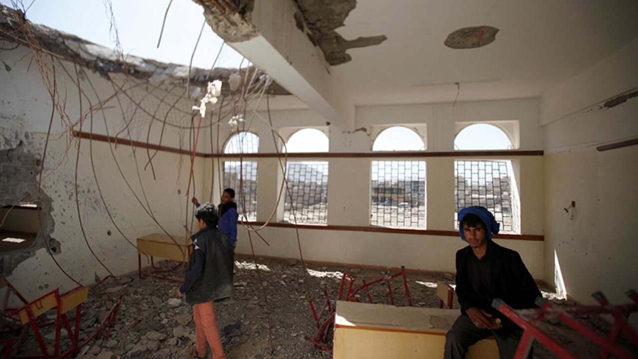 YEMEN-SECURITY/ Boys are pictured in a damaged class of their school which was hit by Saudi-led air strikes last year, as schools open this week in Sanaa, the capital of war-torn Yemen October 5, 2016. REUTERS/Khaled Abdullah - RTSQVP2
