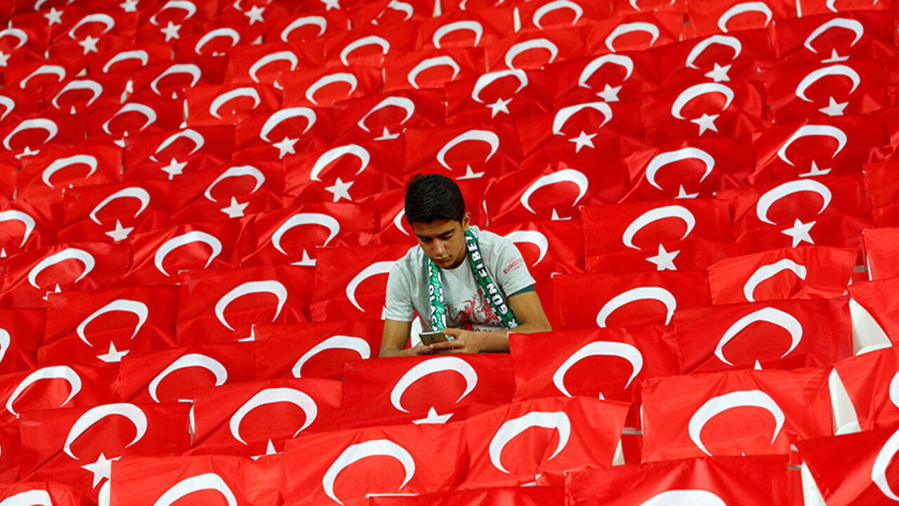 SOCCER-WORLDCUP-TUR-UKR/ Football Soccer - Turkey v Ukraine - World Cup 2018 Qualifiers - Metropolitan Stadium, Konya, Turkey - 6/10/16. A fan uses his mobile phone before the match. REUTERS/Murad Sezer - RTSR2TZ