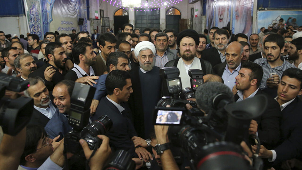 IRAN-ELECTION/ Iranian President-elect Hassan Rouhani (C) speaks to the media following a visit to the Khomeini mausoleum in Tehran June 16, 2013. Reuters/Fars News/Seyed Hassan Mousavi (IRAN - Tags: POLITICS) ATTENTION EDITORS - THIS IMAGE WAS PROVIDED BY A THIRD PARTY. FOR EDITORIAL USE ONLY. NOT FOR SALE FOR MARKETING OR ADVERTISING CAMPAIGNS. THIS PICTURE IS DISTRIBUTED EXACTLY AS RECEIVED BY REUTERS, AS A SERVICE TO CLIENTS - RTX10Q47