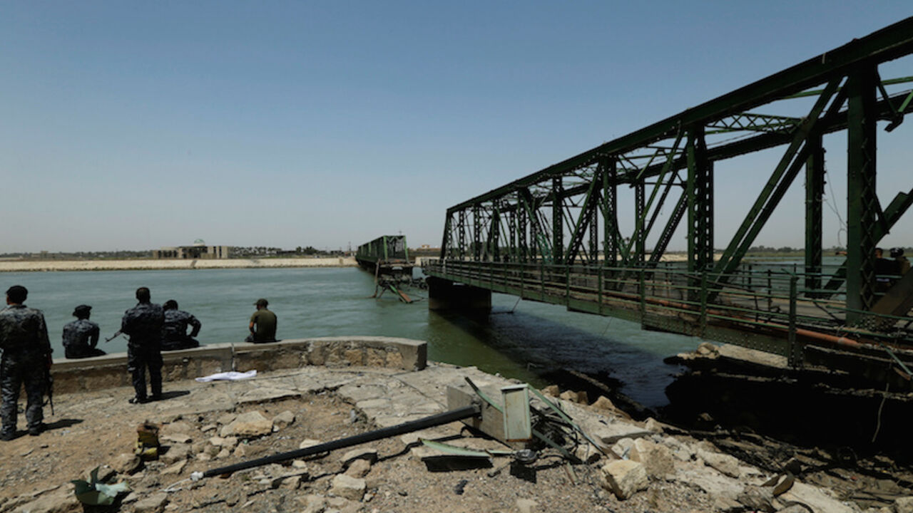 MIDEAST-CRISIS/IRAQ-FALLUJA A bridge over the Euphrates river is seen in Falluja after government forces recaptured the city from Islamic State militants, Iraq, June 27, 2016. REUTERS/Thaier Al-Sudani - RTX2IHKR