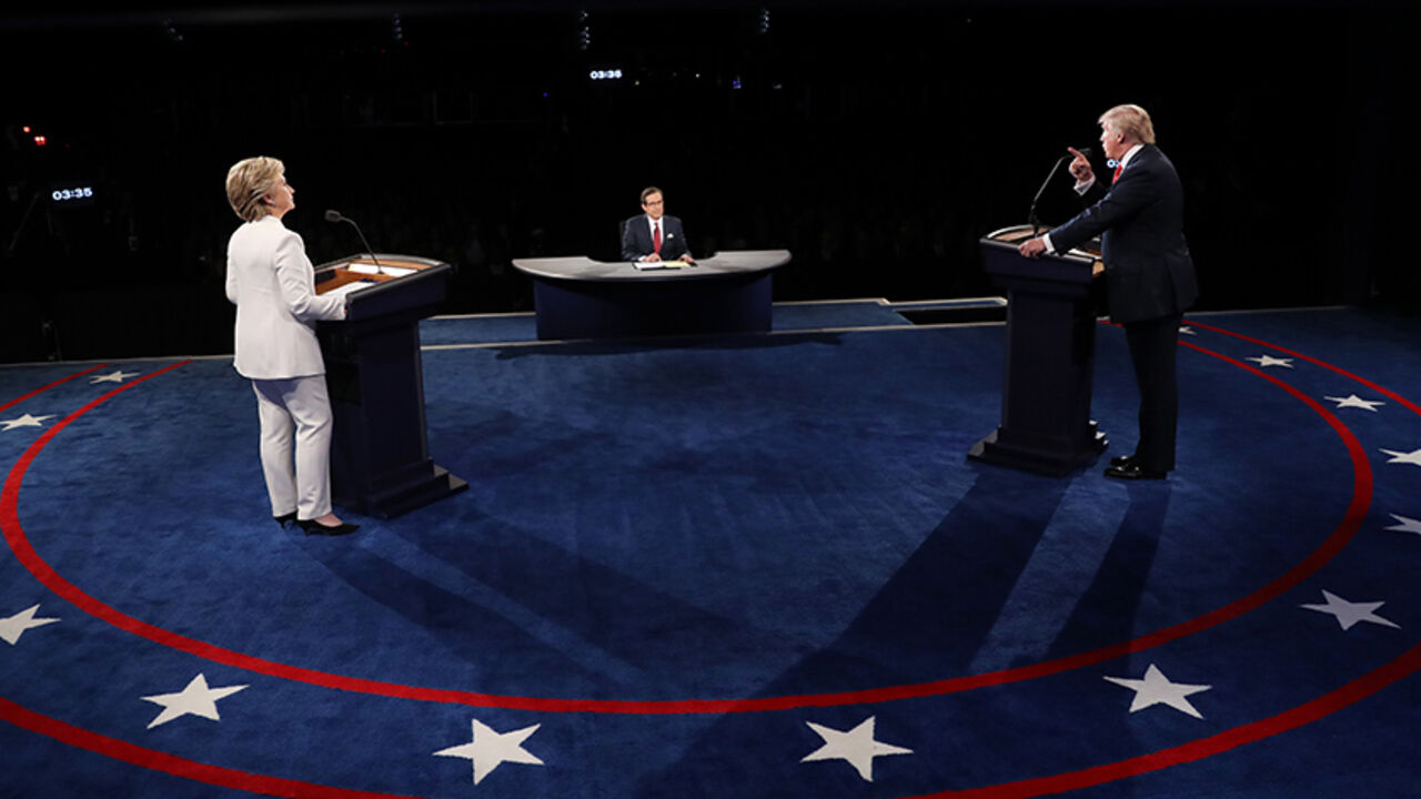 USA-ELECTION/DEBATE Republican U.S. presidential nominee Donald Trump speaks as Democratic U.S. presidential nominee Hillary Clinton listens during their third and final 2016 presidential campaign debate at UNLV in Las Vegas, Nevada, U.S., October 19, 2016. REUTERS/Joe Raedle/Pool - RTX2PM4L