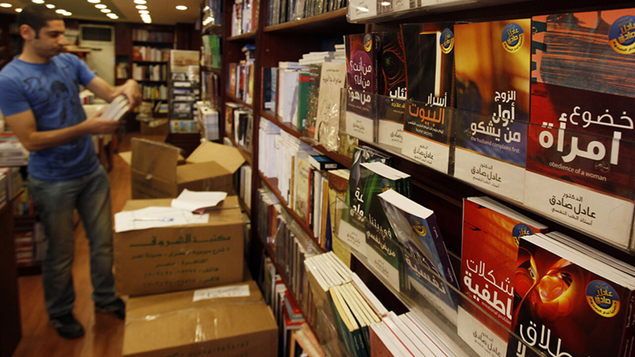 EGYPT SATIRE/ A man browses in a bookshop in downtown Cairo October 13, 2010. Poking fun at everything from the president's almost 30-year rule to the capital's frenetic traffic, satirical books are filling more shelf space in Egypt's bookshops and reflecting the frustrations of a young generation. Limited outlets for political expression, state crackdowns on organized dissent and a growing wealth gap in the Arab world's most populous state are fuelling demand for such literary satire, literary critics say. Picture taken