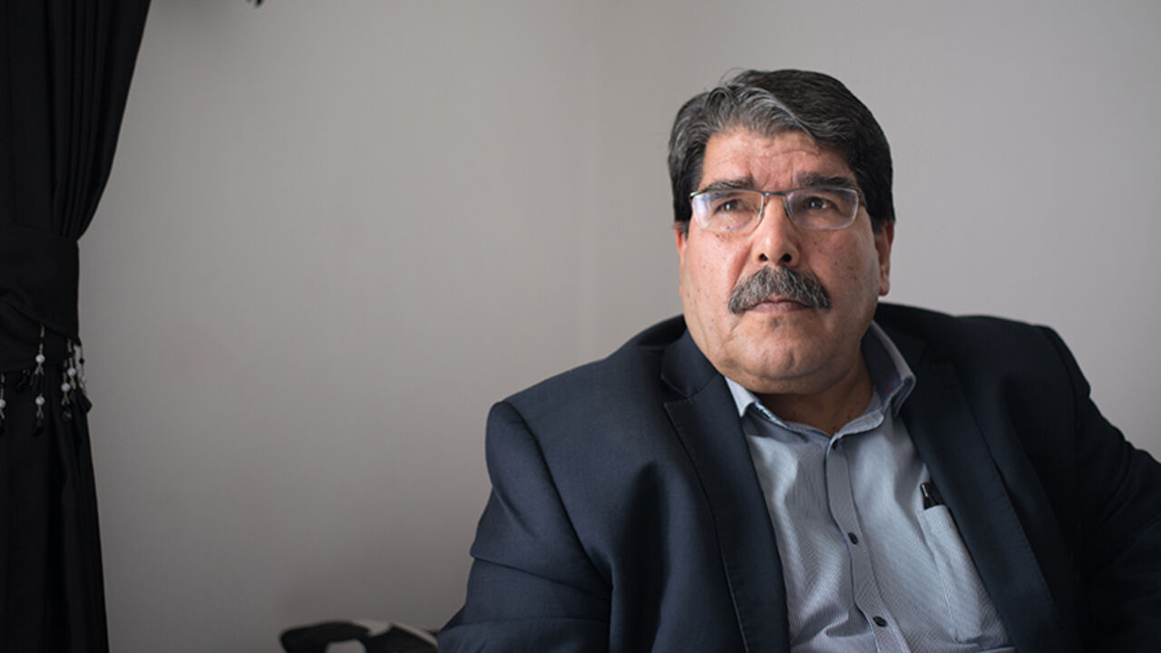 Par7730003 Salih Muslim, co-president of the Syrian Kurdish Democratic Union Party (PYD), listens to a question during an interview in Marseille, southern France, on December 1, 2013. PYD, the biggest Kurdish armed group, wants to establish an autonomous Kurdish state within a federal Syria and a commission is already writing the constitution of this potential state, Muslim told AFP. Syrian Kurds in the war-torn country's northeast announced last month the formation of a transitional autonomous administration after ma
