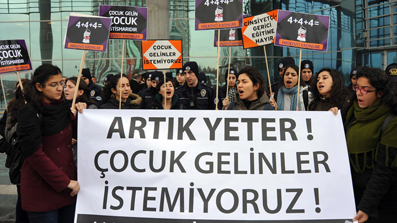 Par7789684 Demonstrators hold a banner reading ''Enough, we don't want child brides'' to protest against child marriage in front of the Family and Social Policies Ministry in Ankara, on February 10, 2014. According to the Turkish Ministry of Interior, in the last three years nearly 135,000 persons below 18 years of age were married in the country, with 20 times more girls than boys. Last year alone the number of under-16 girls whose families applied to the courts to marry them reached 20,000. AFP PHOTO/ADEM ALTAN