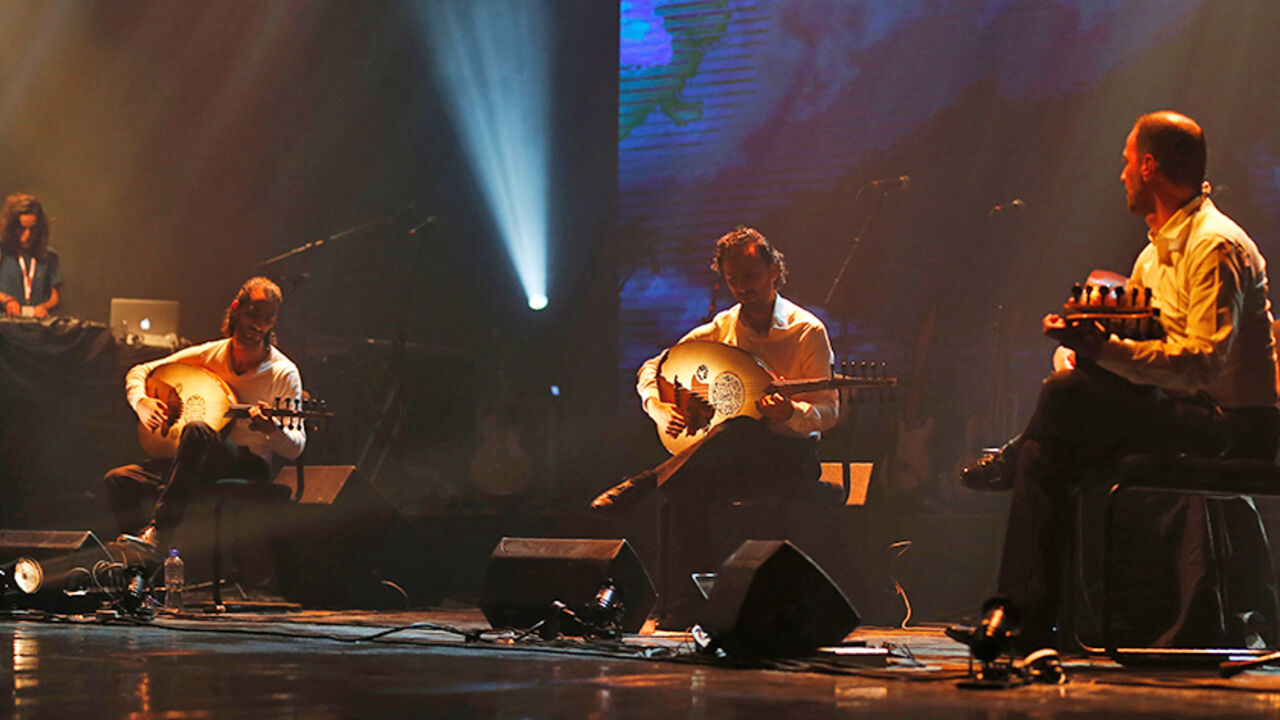 AFP_HI3KL Palestinan oud band "Le Trio Joubran" perform on stage during a Guinness World Record attempt at the Ramallah Cultural Centre in the West Bank city of Ramallah on October 26, 2016.
The band will play their ouds for 12 hours without any break to draw attention to breast cancer and to set a Guinness World Record / AFP / ABBAS MOMANI (Photo credit should read ABBAS MOMANI/AFP/Getty Images)