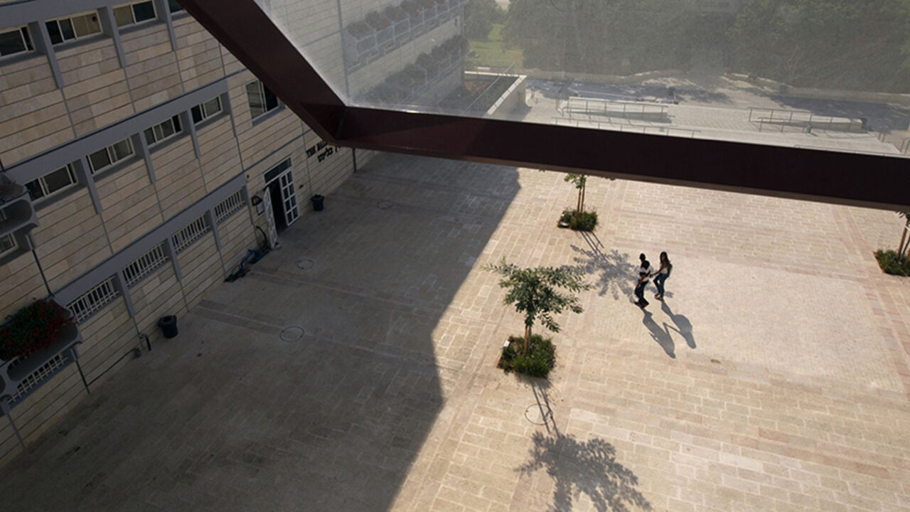 PALESTINIANS-ISRAEL/SETTLEMENTS Students walk at the campus of the Ariel University Centre in the West Bank Jewish settlement of Ariel September 13, 2012. An Israeli government move to upgrade Ariel University Centre in the occupied West Bank to a full-fledged university has put the 30-year-old school at the centre of a debate at the core of the Israeli-Palestinian conflict: how the settlements will figure in defining a future Palestinian state. Picture taken September 13, 2012. To match Feature PALESTINIANS-ISRAEL/SETTLEMENTS REUTERS/Ro
