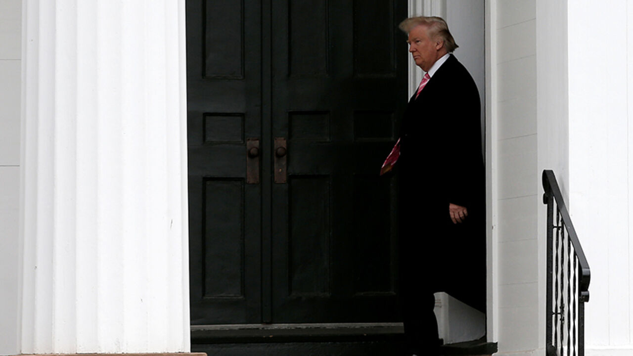 USA-TRUMP/ U.S. President-elect Donald Trump exits the Lamington Presbyterian Church after attending Sunday services in Bedminster, New Jersey, U.S., November 20, 2016. REUTERS/Mike Segar - RTSSI1I