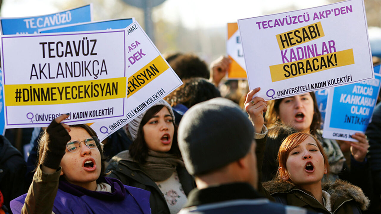 TURKEY-POLITICS/LAW Protesters shout slogans during a protest against a proposal that would have allowed sentencing in cases of sexual abuse committed "without force, threat or trick" before Nov. 16, 2016 to be indefinitely postponed if the perpetrator marries the victim, in front of the Turkish Parlaiment in Ankara, Turkey, November 22, 2016. Banners read, "if the rape will be legitimized the rebellion will go on" (L) and "the bill will be asked from rapist AK Party (AKP) by women (R)" REUTERS/Umit Bektas - RTSSRLU