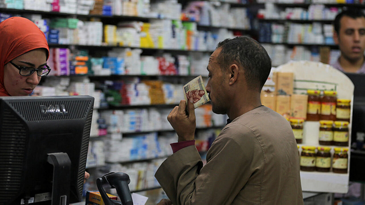 EGYPT-CURRENCY/MEDICINE A customer waits for his medicine at a pharmacy in downtown Cairo, Egypt, November 17, 2016. Picture taken November 17, 2016. REUTERS/Mohamed Abd El Ghany To match Insight EGYPT-CURRENCY/MEDICINE - RTSSSE8