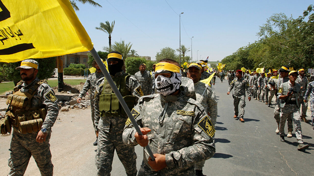 RELIGION-RAMADAN/ Iraqi Shi'ite Muslims from Hashid Shaabi (Popular Mobilization) march during a parade marking the annual al-Quds Day, or Jerusalem Day, during the Muslim holy month of Ramadan in Baghdad, Iraq July 1, 2016. REUTERS/Khalid al Mousily - RTX2J7WT
