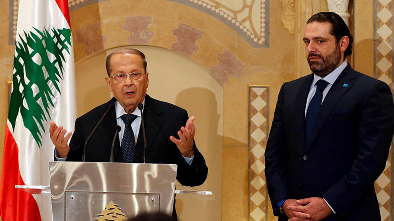 LEBANON-POLITICS/ Christian politician and FPM founder Michel Aoun (L) talks during a news conference next to Lebanon's former prime minister Saad al-Hariri after he said he will back Aoun to become president in Beirut, Lebanon October 20, 2016. REUTERS/Mohamed Azakir - RTX2PR3I