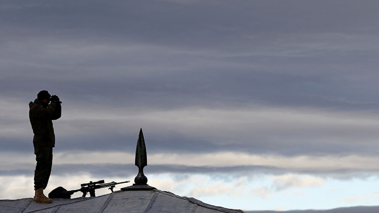 TURKEY-ANNIVERSARY/ A police special forces member stands on top of a roof as part of security measures during a ceremony at the mausoleum of Mustafa Kemal Ataturk, marking the anniversary of his death, in Ankara, Turkey November 10, 2016. REUTERS/Umit Bektas - RTX2SYFC