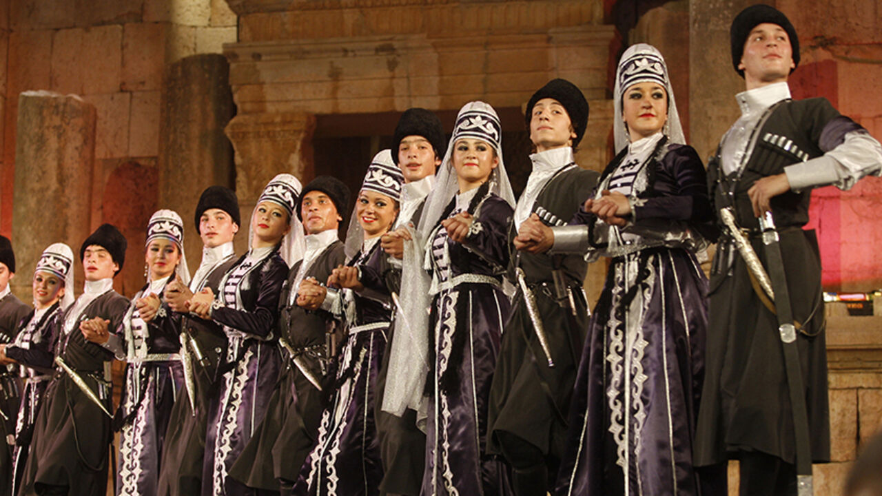 JORDAN/ Dancers from the Circassian minority perform dances from their old folklore heritage at the Southern theatre during the Jerash Festival in the ancient city of Jerash July 26, 2011. The Jerash festival for culture and art is a celebration of both Jordanian and international culture featuring poetry recitals, gymnastic performances, dance, plays and comedy. Picture taken July 26, 2011. REUTERS/Stringer (JORDAN - Tags: ENTERTAINMENT) - RTR2PC4Q