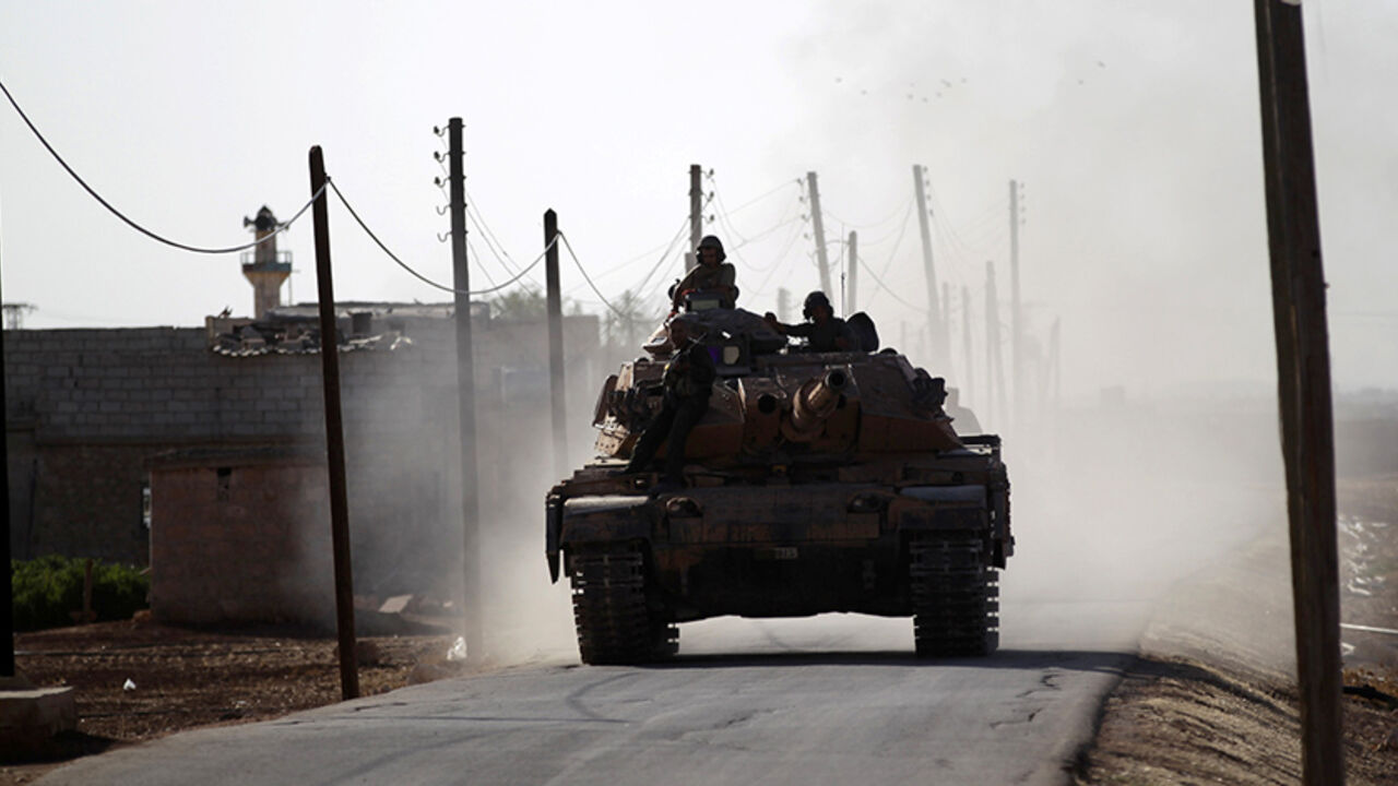 MIDEAST-CRISIS/SYRIA A Turkish tank drives near Guzhe village, northern Aleppo countryside, Syria October 17, 2016. REUTERS/Khalil Ashawi - RTX2P87C