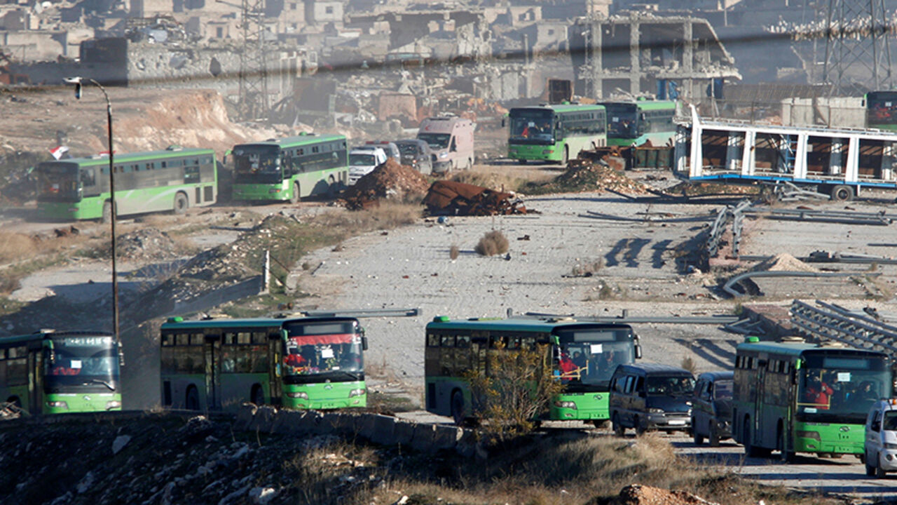 MIDEAST-CRISIS/SYRIA-EVACUATION Ambulances and buses evacuating people drive out of a rebel-held part of Aleppo, Syria December 15, 2016. REUTERS/Omar Sanadiki TPX IMAGES OF THE DAY - RTX2V7EI