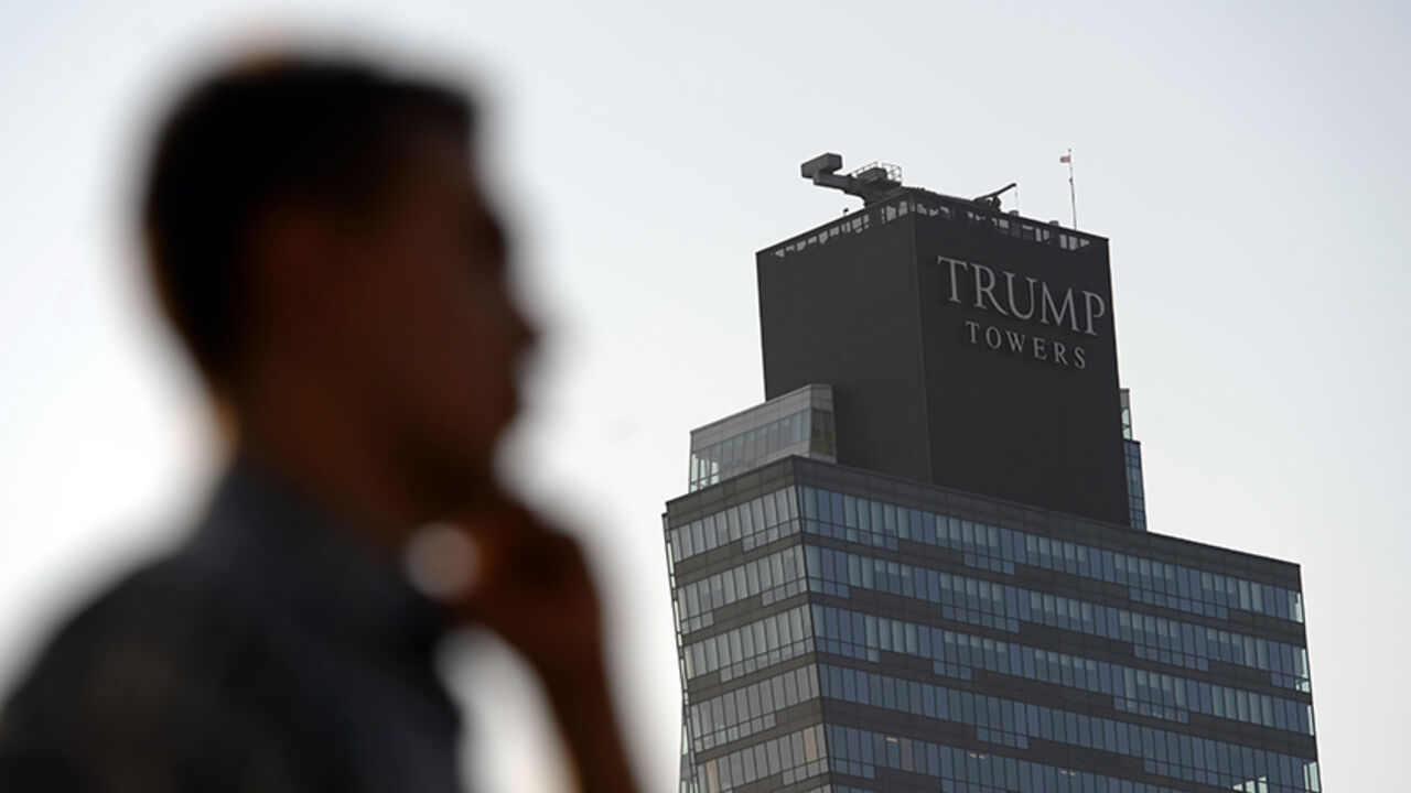Par8240345 A man walks past the Trump Towers building in Istanbul on July 30, 2015. US billionaire Donald Trump handily leads all fellow Republicans in the 2016 presidential race, Hillary Clinton and other Democrats trump him in head-to-head matchups, a poll said July 30. AFP PHOTO/ OZAN KOSE (Photo credit should read OZAN KOSE/AFP/Getty Images)