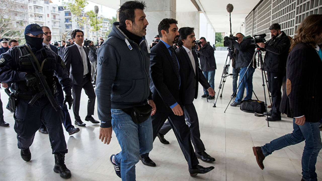 TURKEY-SECURITY/GREECE-MILITARY The eight Turkish soldiers, who fled to Greece in a helicopter and requested political asylum after a failed military coup against the government, are escorted by police officers as they arrive at the Supreme Court in Athens, Greece, January 26, 2017. REUTERS/Alkis Konstantinidis - RTSXGM0