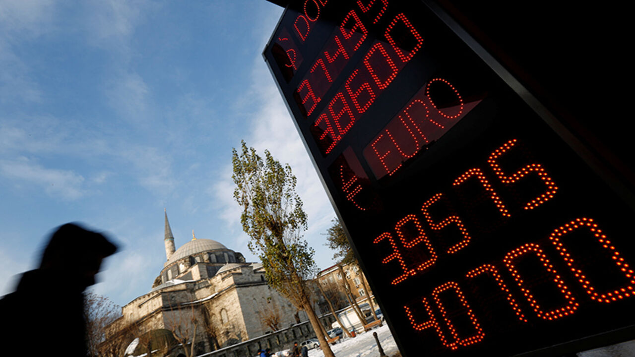 TURKEY-LIRA/ A board showing the currency exchange rates of the U.S. dollar and the Euro against Turkish lira is on display at a currency exchange office in Istanbul, Turkey, January 11, 2017. REUTERS/Murad Sezer - RTX2YFYP