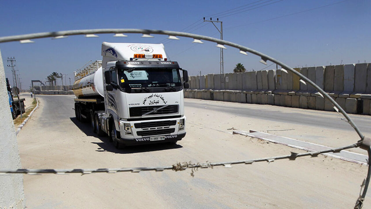 Nic6321222 A truck loaded with goods enters Rafah town through the Kerem Shalom commercial crossing between Israel and the southern Gaza Strip on April 27, 2014 as the crossing reopened after the Jewish Passover holidays. The coastal strip, whose air and sea lanes are blocked by Israel, has three land crossings; Erez and Kerem Shalom with Israel and Rafah with Egypt. AFP PHOTO / SAID KHATIB (Photo credit should read SAID KHATIB/AFP/Getty Images)