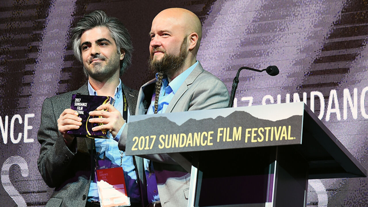 693424665TB00006_Awards_Nig PARK CITY, UT - JANUARY 28: Steen Johannessen and Feras Fayyad accept the World Cinema: Grand Jury Prize for their film "Last Men in Aleppo" during the 2017 Sundance Film Festival Awards Night Ceremony at Basin Recreation Field House on January 28, 2017 in Park City, Utah. (Photo by Nicholas Hunt/Getty Images for Sundance Film Festival)