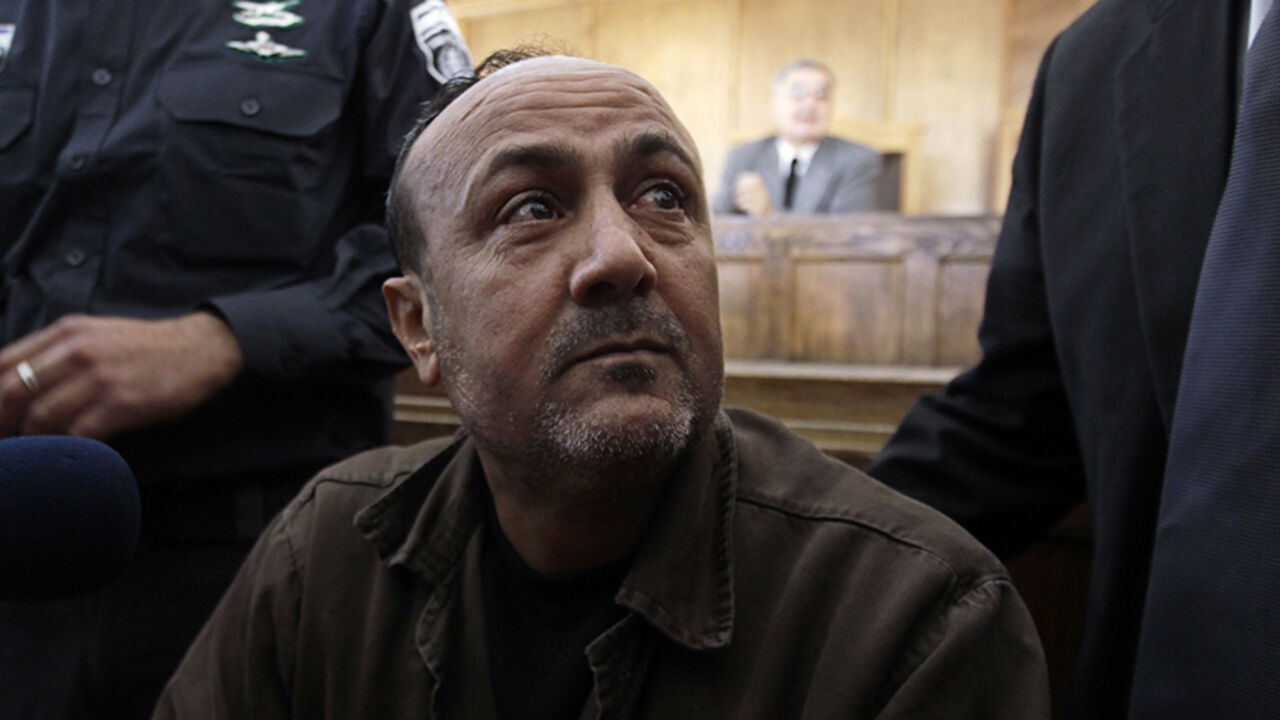PALESTINIANS-ISRAEL/ Jailed Fatah leader Marwan Barghouti attends a deliberation at Jerusalem Magistrate's court January 25, 2012. Convicted of murder for his role in attacks on Israelis, Barghouti was jailed for life by Israel in 2004. REUTERS/Ammar Awad (JERUSALEM - Tags: POLITICS CRIME LAW) - RTR2WTIQ