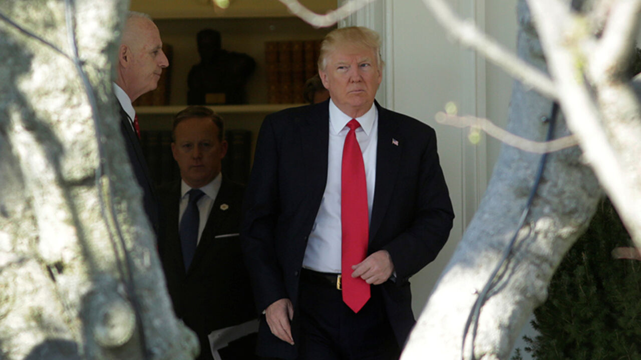 U.S. President Donald Trump walks out from the Oval Office of the White House in Washington, U.S., en route to CPAC, February 24, 2017. REUTERS/Yuri Gripas - RTS1060Z