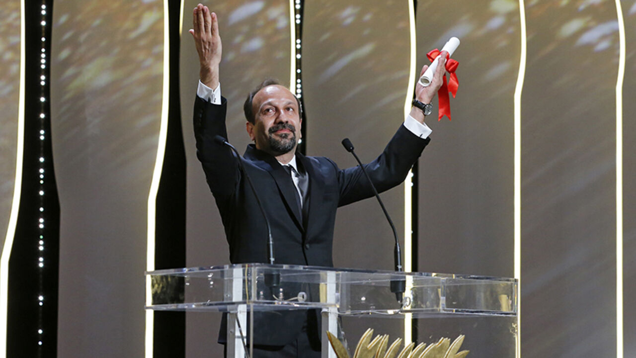 FILMFESTIVAL-CANNES/ Director Asghar Farhadi, Best screenplay award winner for his film "Forushande" (The Salesman), reacts on stage during the closing ceremony of the 69th Cannes Film Festival in Cannes, France, May 22, 2016. REUTERS/Yves Herman TPX IMAGES OF THE DAY - RTSFF3F