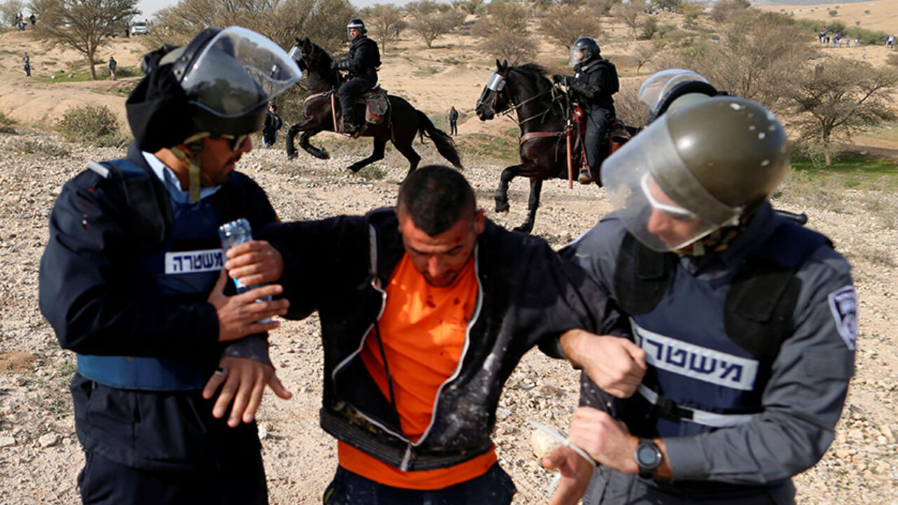 ISRAEL-RAMMING/ REFILE - UPDATING SLUGArab Israelis clash with Israeli riot policemen in Umm Al-Hiran, a Bedouin village in Israel's southern Negev Desert January 18, 2017. REUTERS/Ammar Awad - RTSW0X6