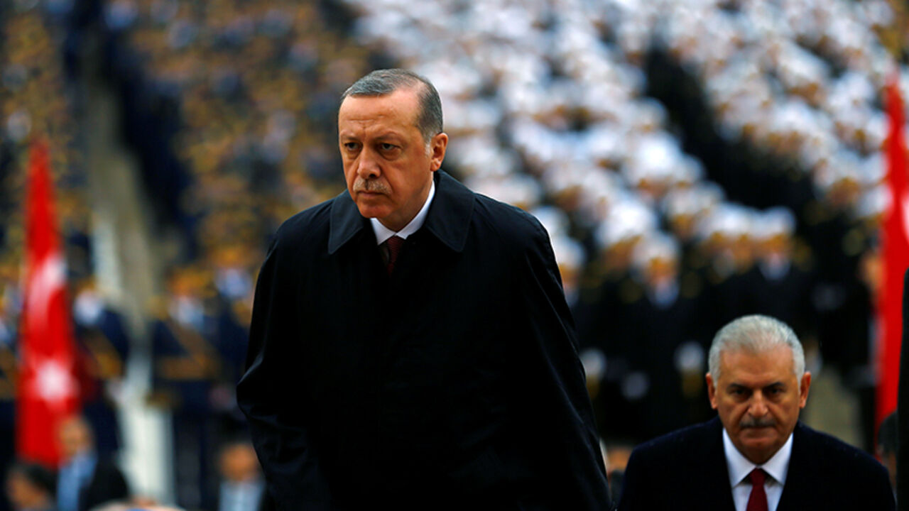 TURKEY-ANNIVERSARY/ Turkey's President Tayyip Erdogan attends a Republic Day ceremony at Anitkabir, the mausoleum of modern Turkey's founder Ataturk, to mark the republic's anniversary as he is flanked by Prime Minister Binali Yildirim (R) in Ankara, Turkey, October 29, 2016. REUTERS/Umit Bektas - RTX2QXOL