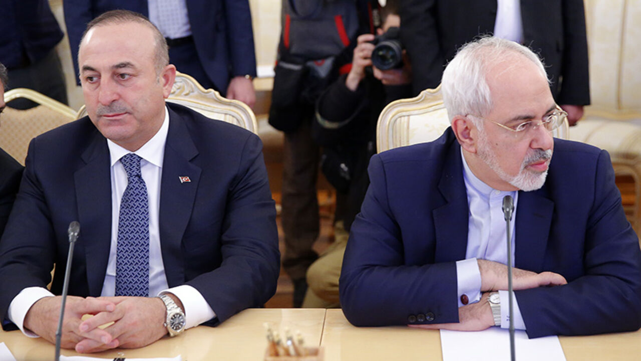 MIDEAST-CRISIS/SYRIA-TURKEY-RUSSIA Foreign ministers, Mevlut Cavusoglu (2nd L) of Turkey and Mohammad Javad Zarif (R) of Iran, attend a meeting in Moscow, Russia, December 20, 2016. REUTERS/Maxim Shemetov - RTX2VUBT