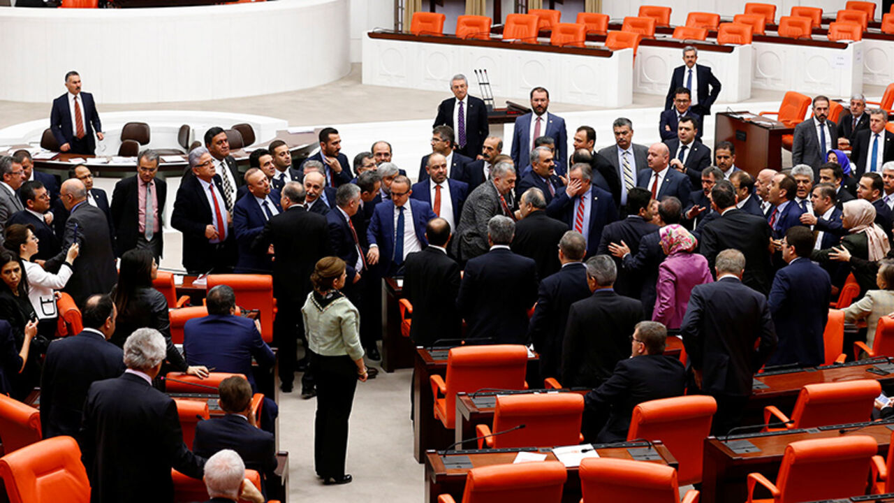 TURKEY-POLITICS/CONSTITUTION Lawmakers from ruling AK Party and the main opposition CHP scuffle during a debate on the proposed constitutional changes at the Turkish Parliament in Ankara, Turkey, January 12, 2017. REUTERS/Umit Bektas - RTX2YN0M