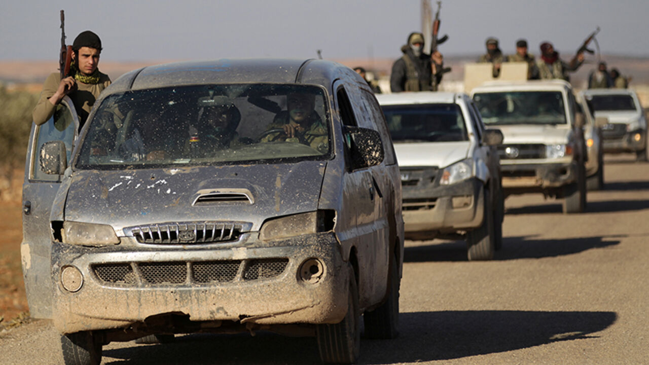MIDEAST-CRISIS/SYRIA-ALBAB Rebel fighters ride in a convoy on the outskirts of the Islamic State-controlled northern Syrian town of al-Bab, Syria February 3, 2017. REUTERS/Khalil Ashawi - RTX2ZJJ9