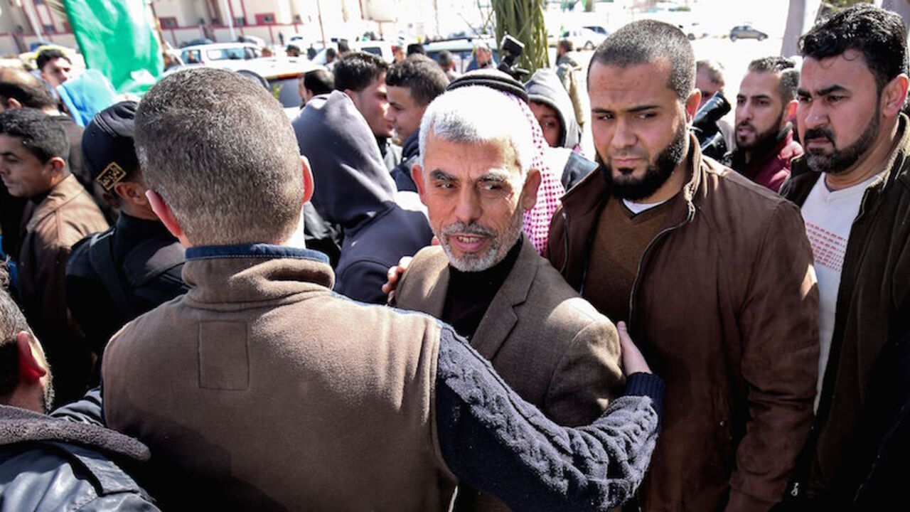 AFP_M04II Yahya Sinwar (C), the new leader of Hamas in the Gaza Strip, arrives for the opening of a new mosque in Rafah town in the southern Gaza Strip on February 24, 2017. / AFP / SAID KHATIB (Photo credit should read SAID KHATIB/AFP/Getty Images)