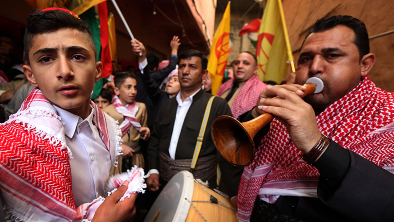 AFP_MU463 Iraqi Kurds play music as they walk through the town of Akra, 500 km north of Baghdad, on March 20, 2017 as they celebrate the Noruz spring festival.
The Persian New Year is an ancient Zoroastrian tradition celebrated by Iranians and Kurds which coincides with the vernal (spring) equinox and is calculated by the solar calender. / AFP PHOTO / SAFIN HAMED (Photo credit should read SAFIN HAMED/AFP/Getty Images)