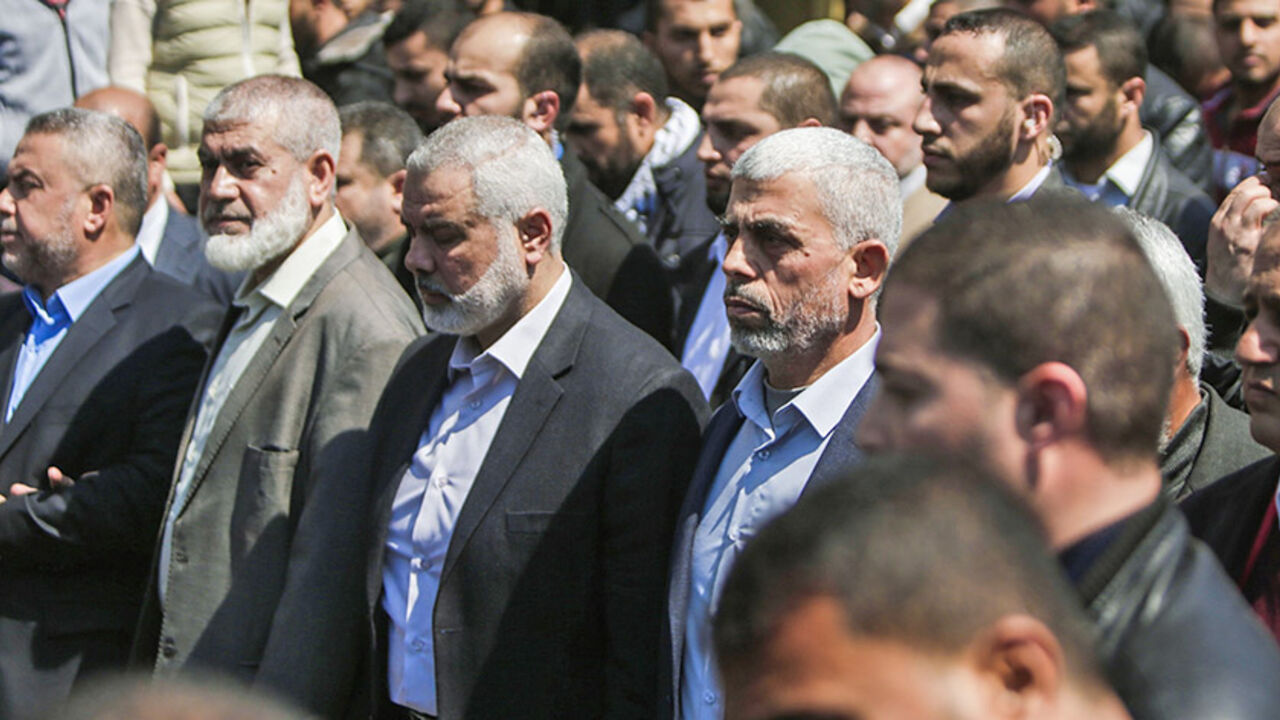 AFP_MZ5JP EDITORS NOTE: Graphic content / Yahya Sinwar (C-R), the new leader of Hamas in the Gaza Strip and senior political leaders of the Islamist movement, Ismail Haniyeh (C-L) and Rawhi Moshtaha (L-2) attend the funeral of Hamas official, Mazen Faqha in Gaza city on March 25, 2017.
Gunmen in the Gaza Strip had shot dead the Hamas official on March 24, 2017, according to Iyad al-Bozum, an interior ministry spokesman in the Hamas-ruled Gaza Strip. Faqha had been released by Israel six years earlier in the 2011 pris