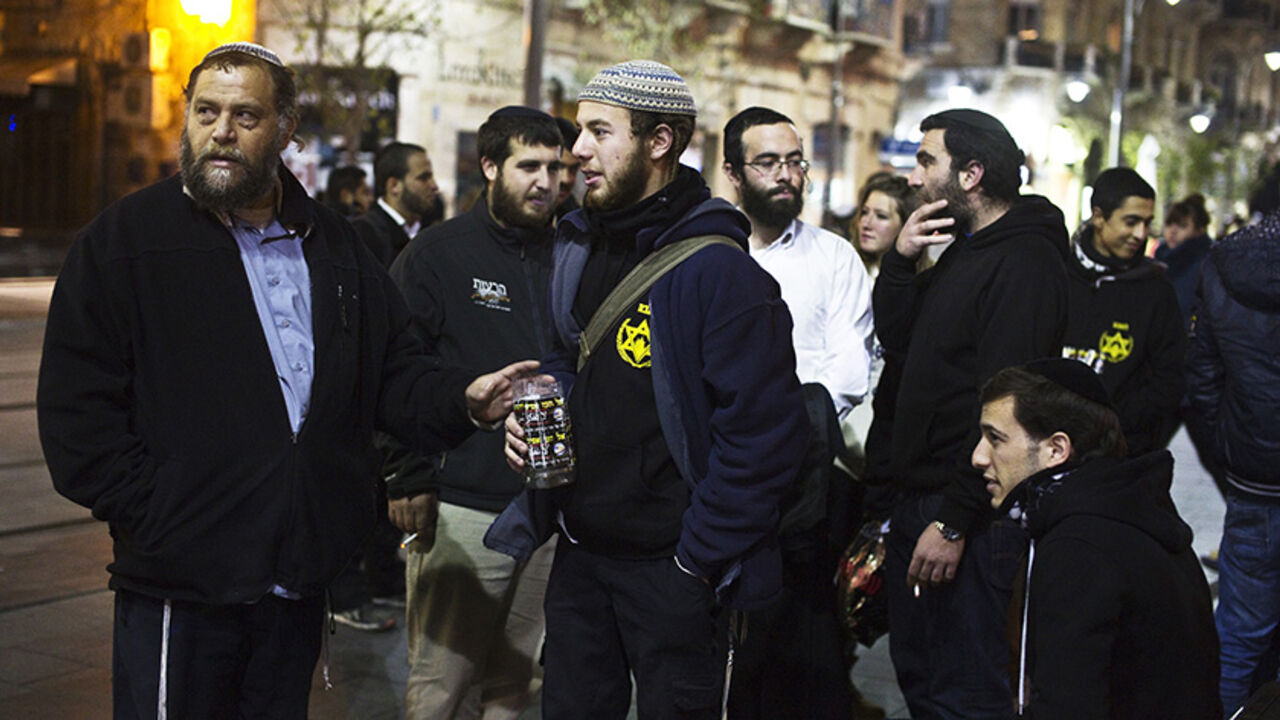 MIDEAST-ISRAEL/LEHAVA Benzion Gopshtein (L), leader of the far-right Israeli group Lehava, gathers with fellow activists in Jerusalem December 25, 2014. A far-right Israeli group that agitates against Arabs in the name of religion and national security is forcing the Jewish state into a legal and political balancing act as it tries to contain sectarian violence. The authorities are under pressure to deal with anyone encouraging Jewish retaliation against Israeli Arabs and Palestinians. Efforts to tackle Lehava, however, may be
