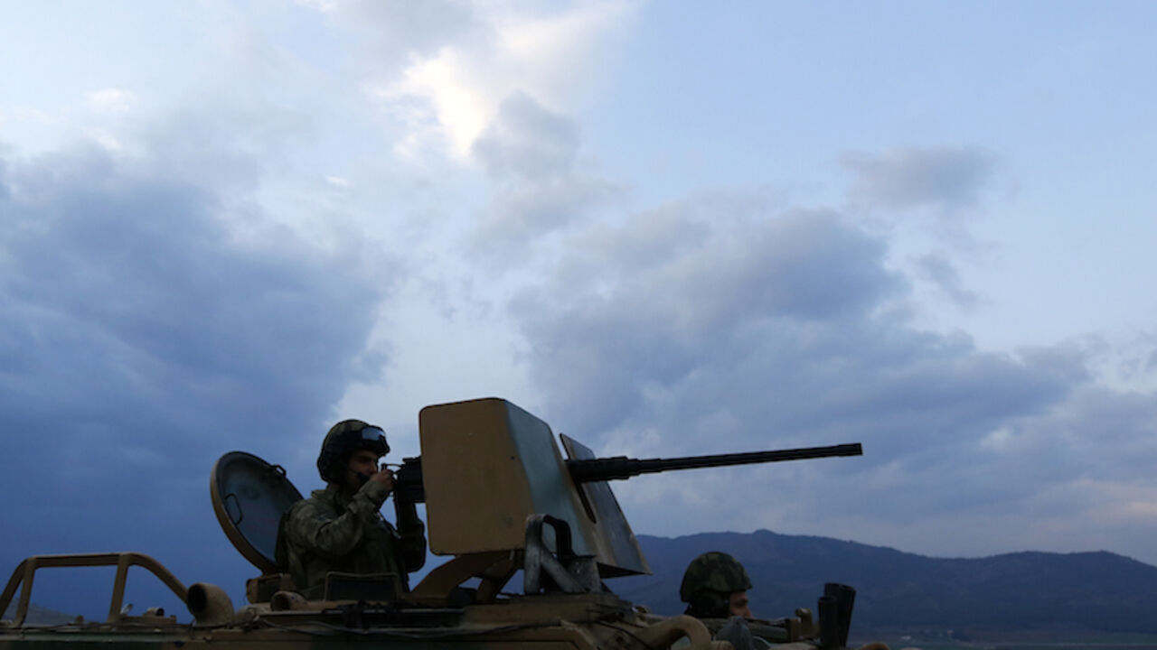 MIDEAST-CRISIS/SYRIA-TURKEY-BORDER A Turkish soldier on an armoured military vehicle surveys the border line between Turkey and Syria, near the southeastern city of Kilis, Turkey, March 2, 2017. REUTERS/Murad Sezer - RTS115IB
