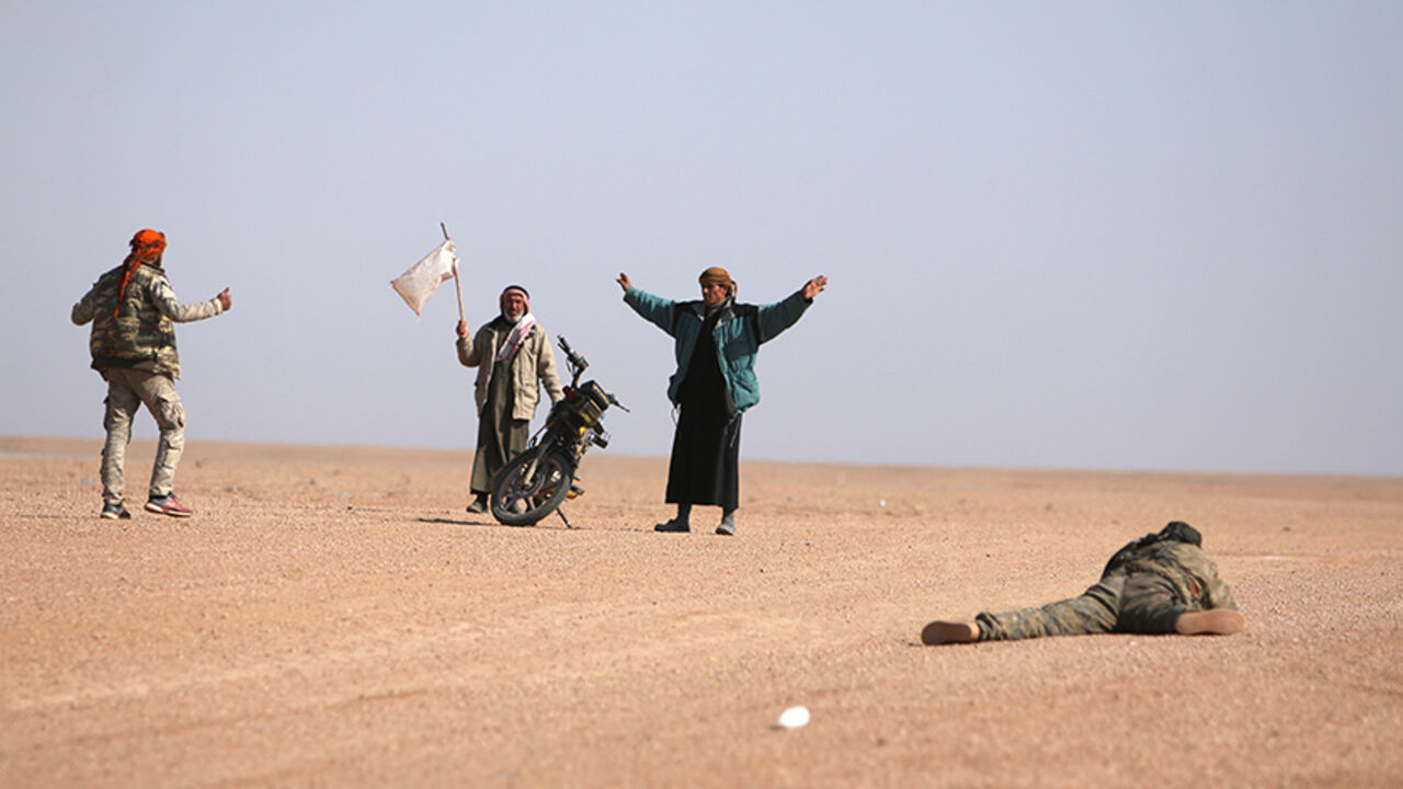 MIDEAST-CRISIS/SYRIA Men that fled areas of clashes surrender to Syrian Democratic Forces(SDF) fighters north of Raqqa city, Syria March 8, 2017. REUTERS/Rodi Said - RTS12102