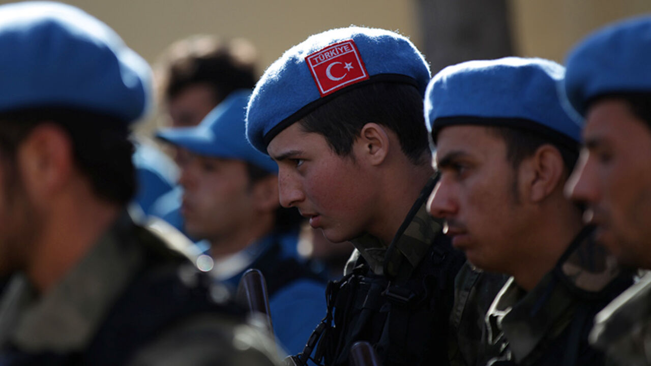 MIDEAST-CRISIS/SYRIA-TURKEY-POLICE A member of the Free police, wearing a Turkish flag on his hat, attends a ceremony celebrating the inauguration of the "Free Police" in the Syrian border town of Jarablus January 24, 2017. REUTERS/Khalil Ashawi - RTSX6LE