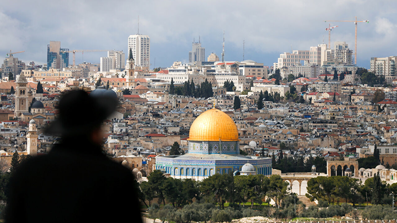 USA-TRUMP/ISRAEL An ultra-Orthodox Jewish man is seen in the foreground as the Dome of the Rock, located in Jerusalem's Old City on the compound known to Muslims as Noble Sanctuary and to Jews as Temple Mount, is seen in the background February 15, 2017. REUTERS/Ammar Awad - RTSYSCA