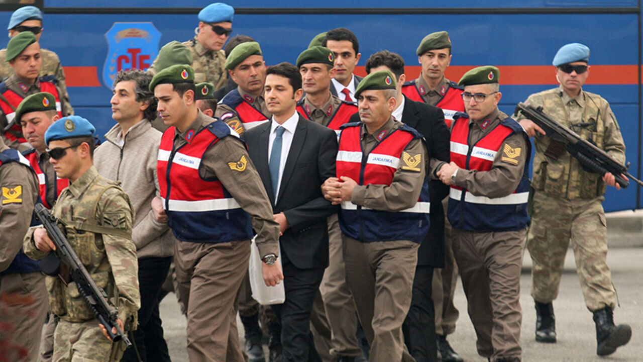 TURKEY-SECURITY/ERDOGAN-TRIAL Turkish soldiers accused of attempting to assassinate President Tayyip Erdogan on the night of the failed last year's July 15 coup, are escorted by gendarmes as they arrive for the first hearing of the trial in Mugla, Turkey, February 20, 2017. REUTERS/Kenan Gurbuz - RTSZGNP