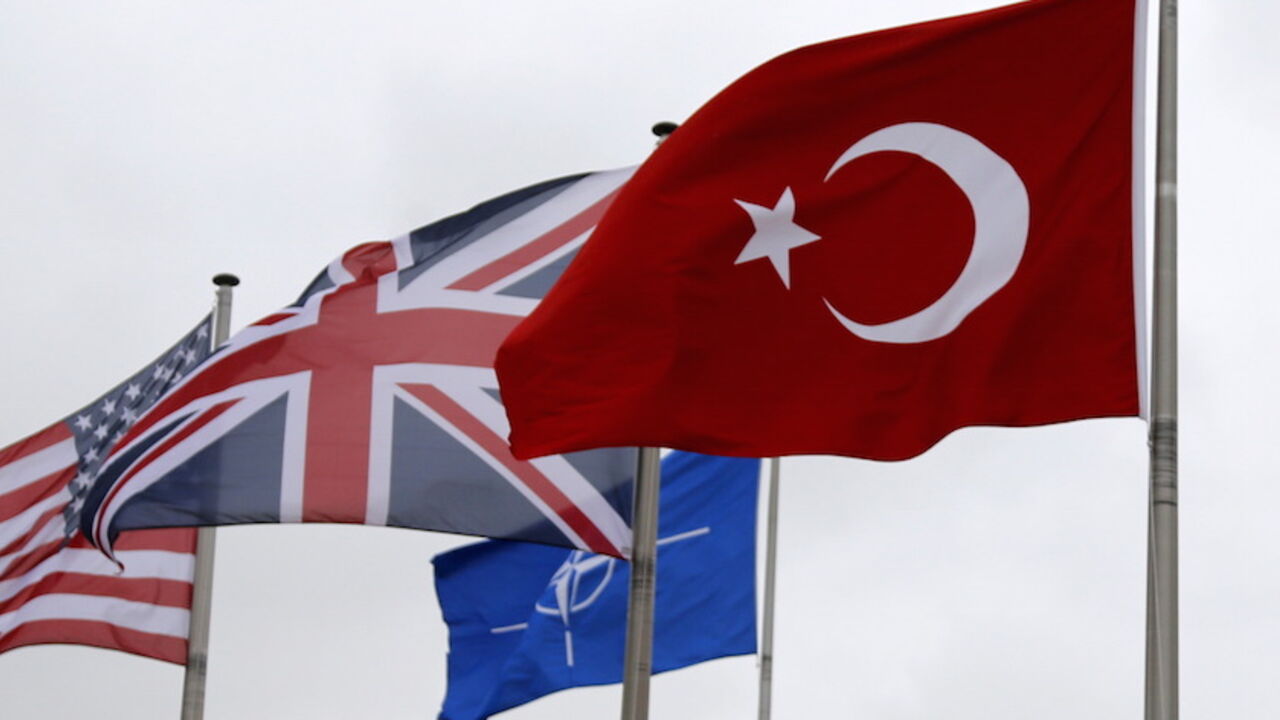 MIDEAST-CRISIS/TURKEY-NATO A Turkish flag (R) flies among others flags of NATO members during the North Atlantic Council (NAC) following Turkey's request for Article 4 consultations, at the Alliance headquarters in Brussels, Belgium, July 28, 2015. Turkey sought moral support for its campaign against militants in Syria and Iraq at an emergency meeting on Tuesday with its North Atlantic allies, with both NATO and Ankara playing down any idea of a call for military help from the alliance. Turkey requested urgent consultations with its