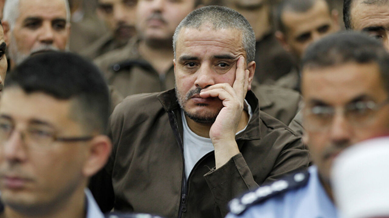 JORDAN-ISRAEL/SOLDIER Ahmad Daqamseh, a Jordanian soldier convicted of killing seven Israeli schoolgirls on March 13, 1997, is seen at Um Alluol prison in the city of Mafraq, Jordan, July 30, 2013. Picture taken July 30, 2013. REUTERS/Muhammad Hamed - RTX30MQ8