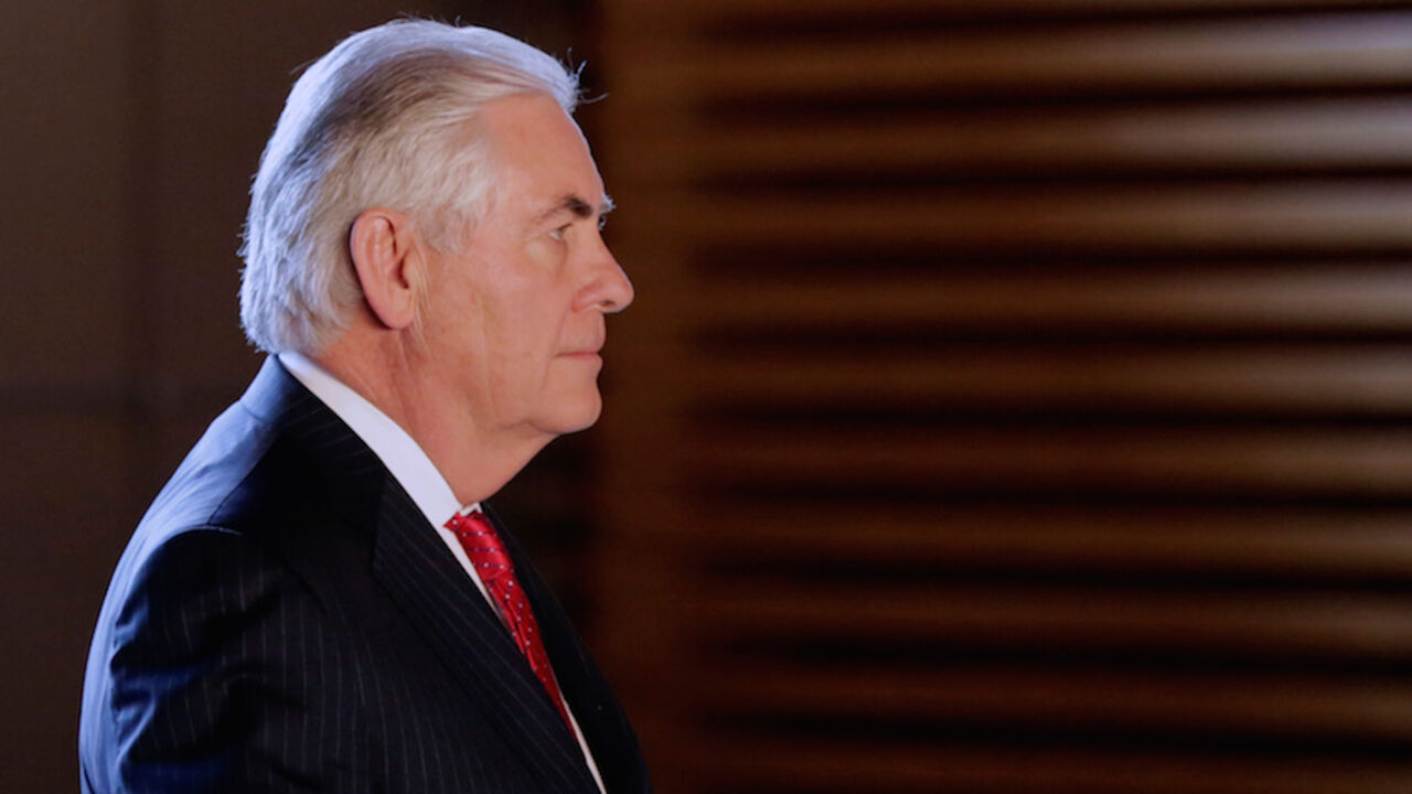 TILLERSON-ASIA/JAPAN U.S. Secretary of State Rex Tillerson walks to meet Japanese Prime Minister Shinzo Abe, prior to their meeting at the prime minister's office in Tokyo, Japan March 16, 2017. REUTERS/Eugene Hoshiko/Pool - RTX318XX