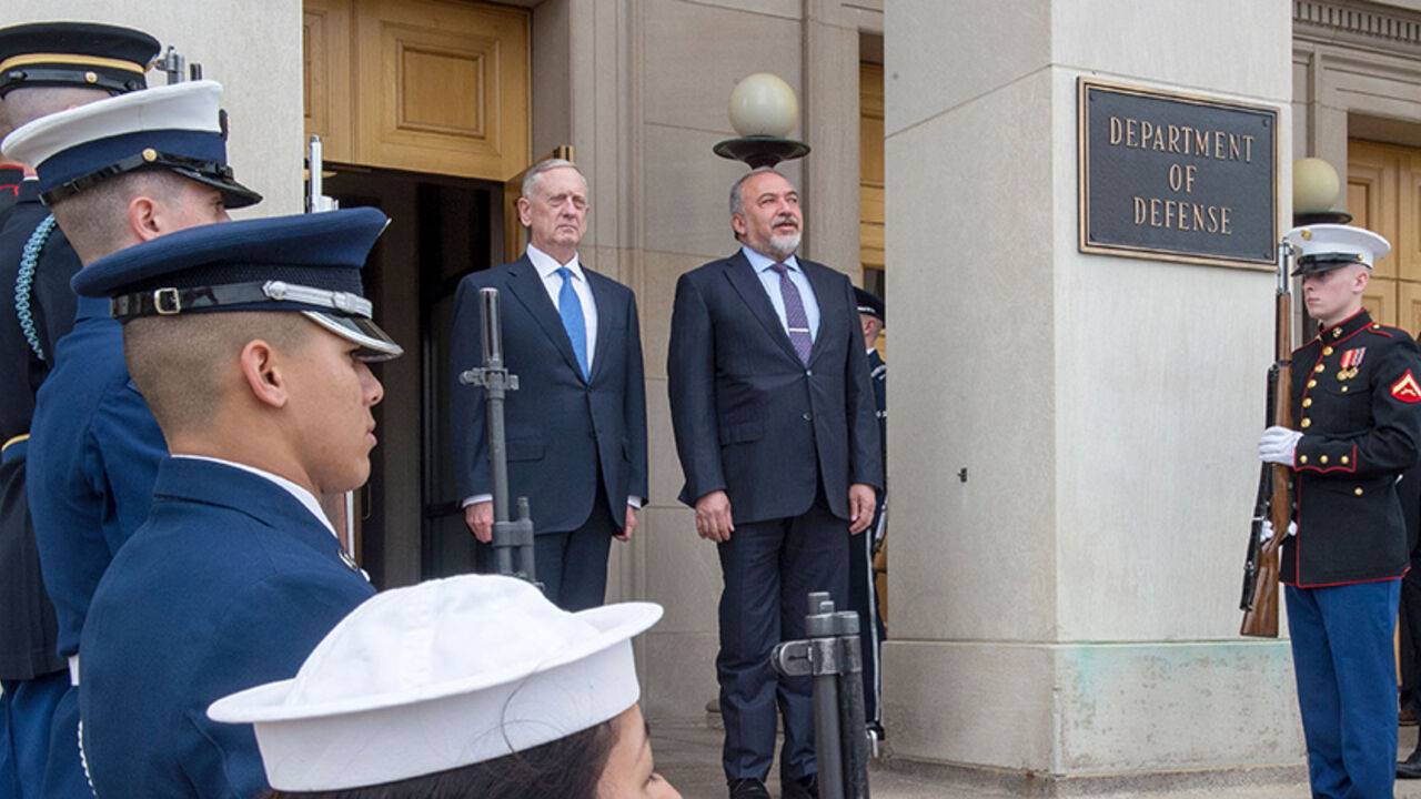 AFP_MG4M8 US Secretary of Defense James Mattis(L) stands with Israel's Minister of Defense Avigdor Lieberman with an Honor Guard, listening to their respective national anthems upon arrival to the Pentagon on March 7, 2017 in Washington, DC. / AFP PHOTO / PAUL J. RICHARDS (Photo credit should read PAUL J. RICHARDS/AFP/Getty Images)