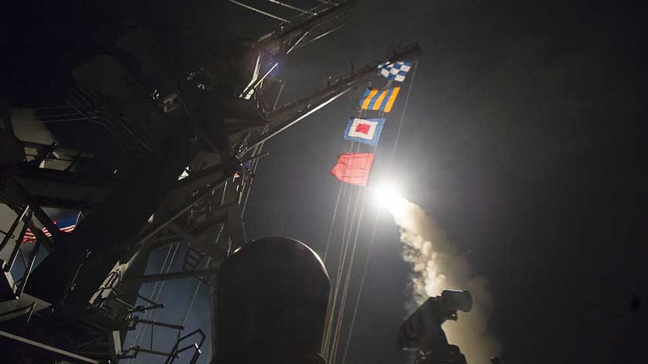 95252594 MEDITERRANEAN SEA - APRIL 7: In this handout provided by the U.S. Navy, the guided-missile destroyer USS Ross fires a Tomahawk land attack missile April 7, 2017 in the Mediterranean Sea. The Arleigh Burke-class Ross was one of two destroyers that fired a total of 59 cruise missiles at a Syrian military airfield in retaliation for a chemical attack that killed scores of civilians this week. The attack was the first direct U.S. assault on Syria and the government of President Bashar al-Assad in the six-year