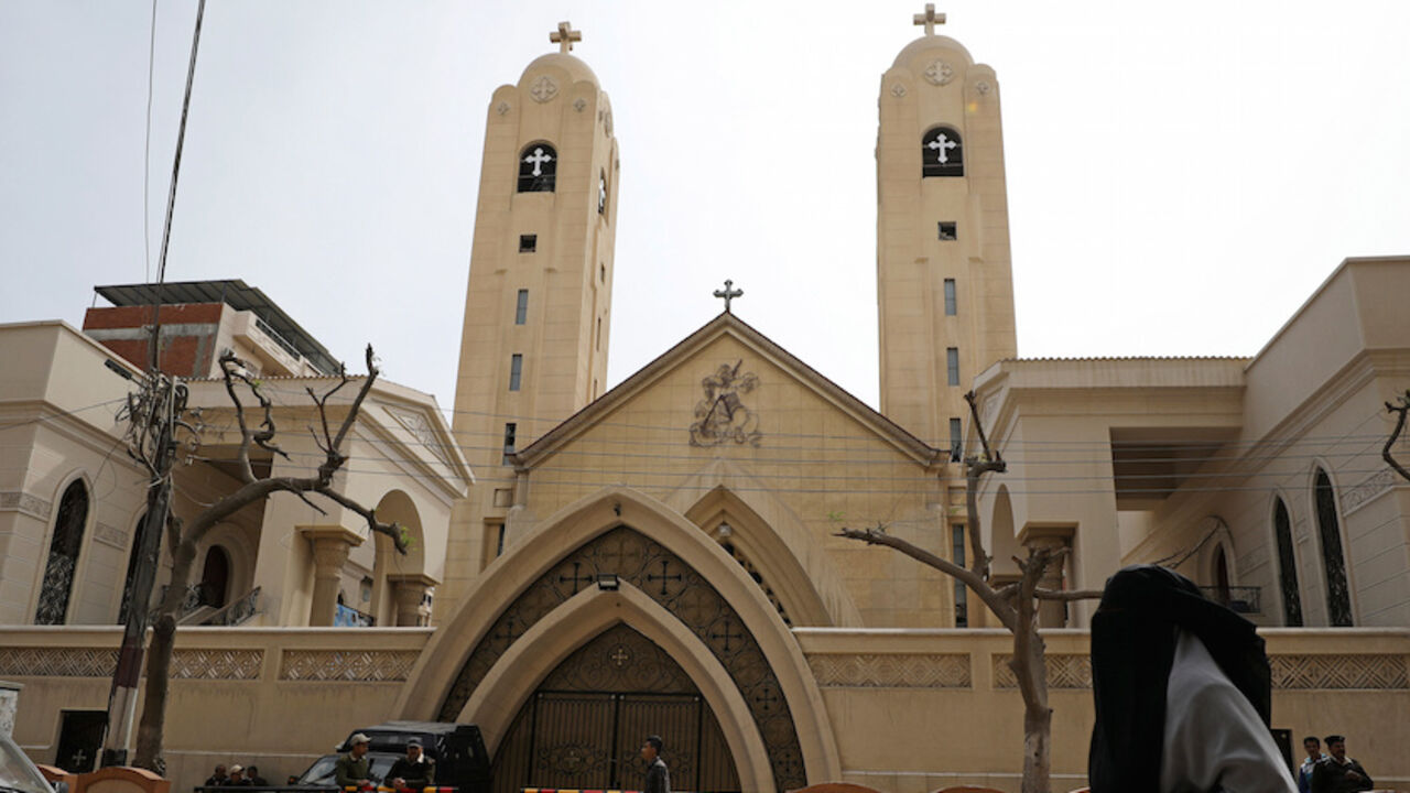 EGYPT-VIOLENCE/CHRISTIANS A woman passes in front of the Coptic church that was bombed on Sunday in Tanta, Egypt, April 10, 2017. REUTERS/Mohamed Abd El Ghany - RTX34XS0