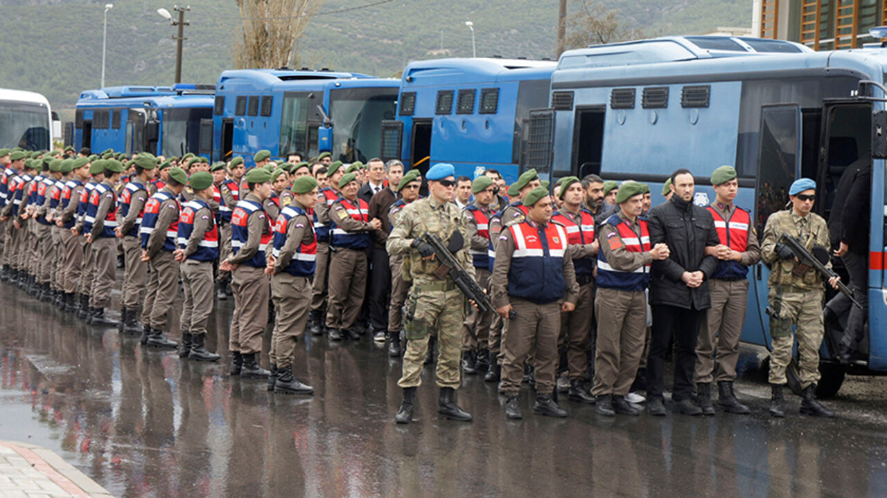 TURKEY-SECURITY/ERDOGAN-TRIAL Turkish soldiers accused of attempting to assassinate President Tayyip Erdogan on the night of the failed July 15 coup, are escorted by gendarmes as they arrive at the court in Mugla, Turkey, March 8, 2017. REUTERS/Kenan Gurbuz - RTS11XPE
