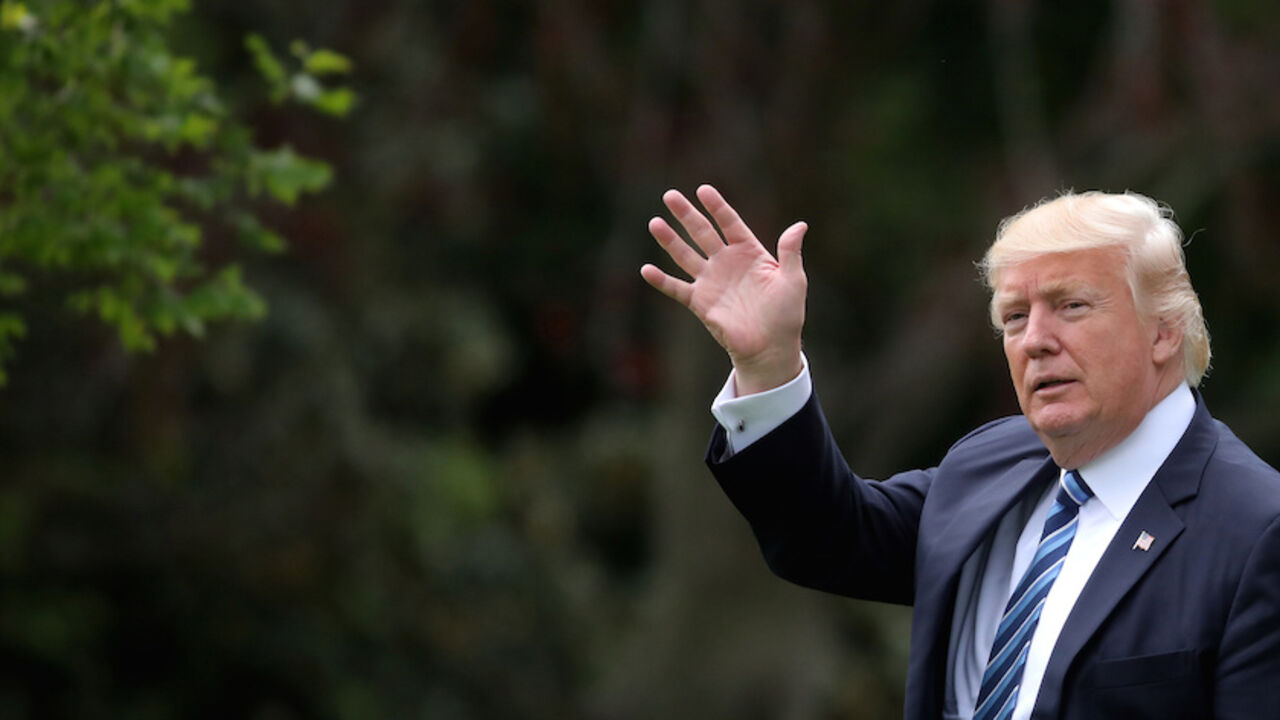 USA-TRUMP/ U.S. President Donald Trump waves as he leaves the Oval Office of the White House in Washington, U.S., before his departure to New York May 4, 2017. REUTERS/Carlos Barria - RTS1581R